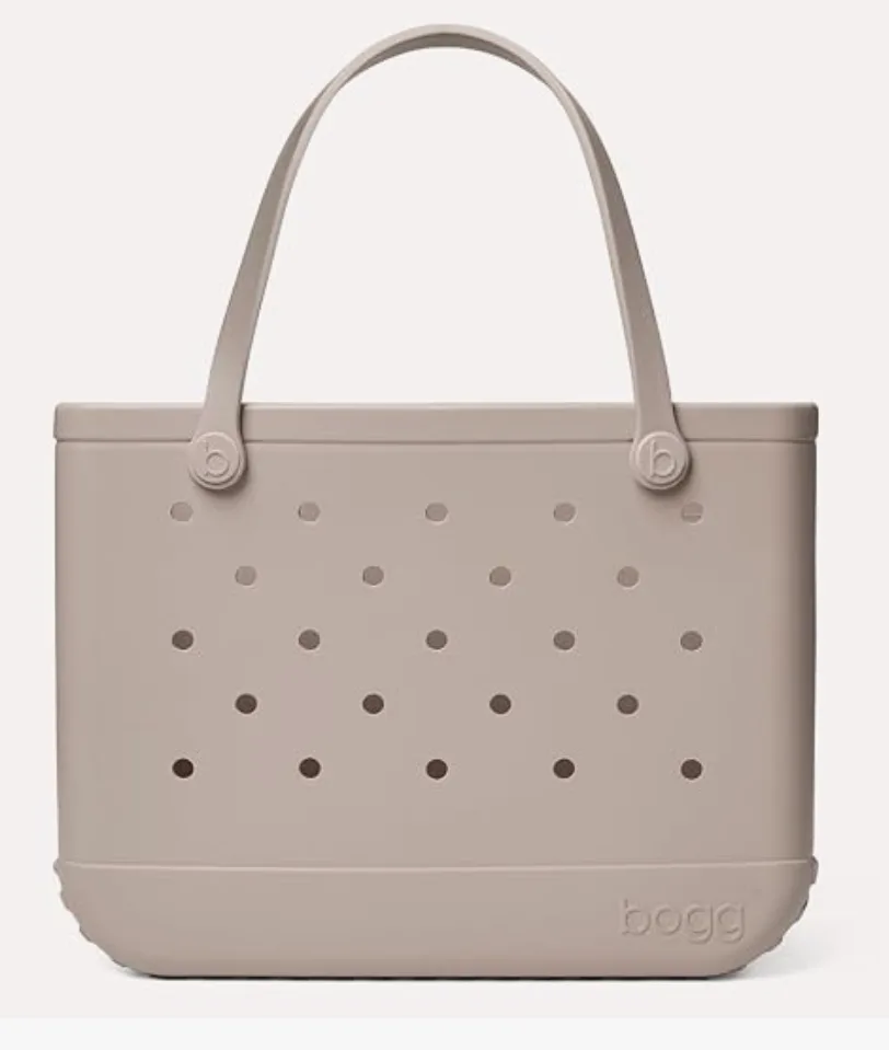 Beige waterproof beach tote bag with durable handles, perfect for carrying towels, sunscreen, snacks, toys, and family beach essentials.